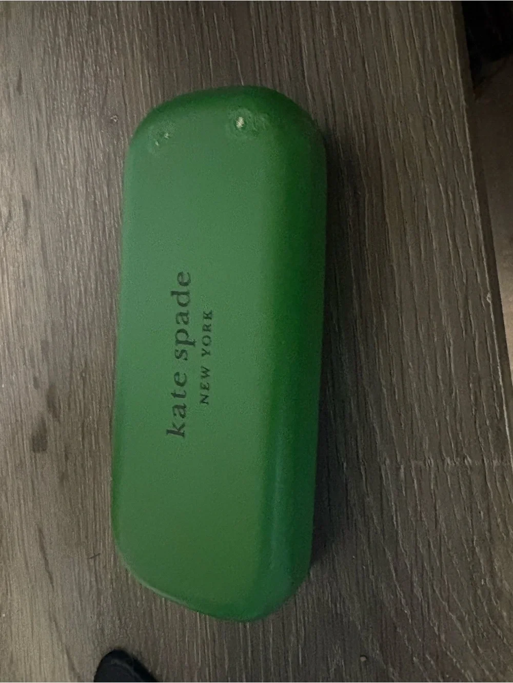kate spade Green glass case. Has flaw on front.